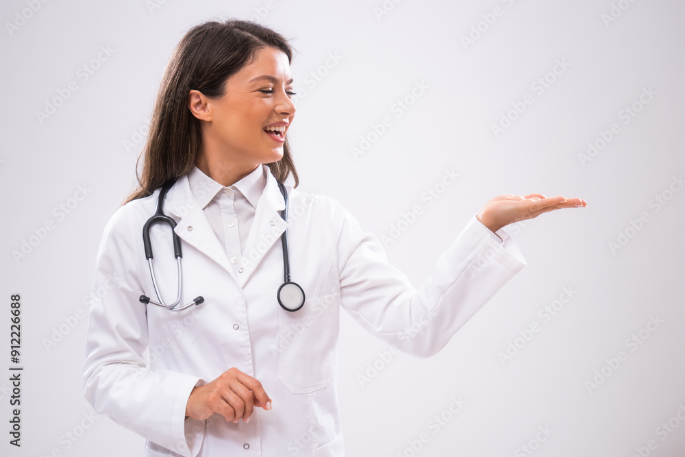 Portrait of doctor who is cheerful and holding blank space for your advert. Portrait of doctor who is cheerful and holding blank space for your advert.