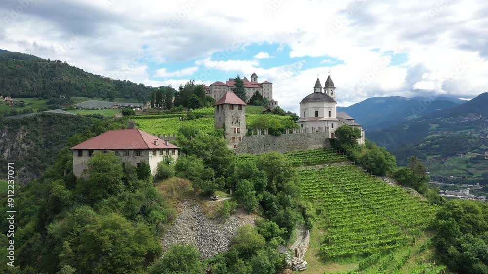 Aerial view of Castle on the rock, vineyards and winery on a sunny summer day Bolzano Italy Aerial view of Castle on the rock, vineyards and winery on a sunny summer day Bolzano Italy