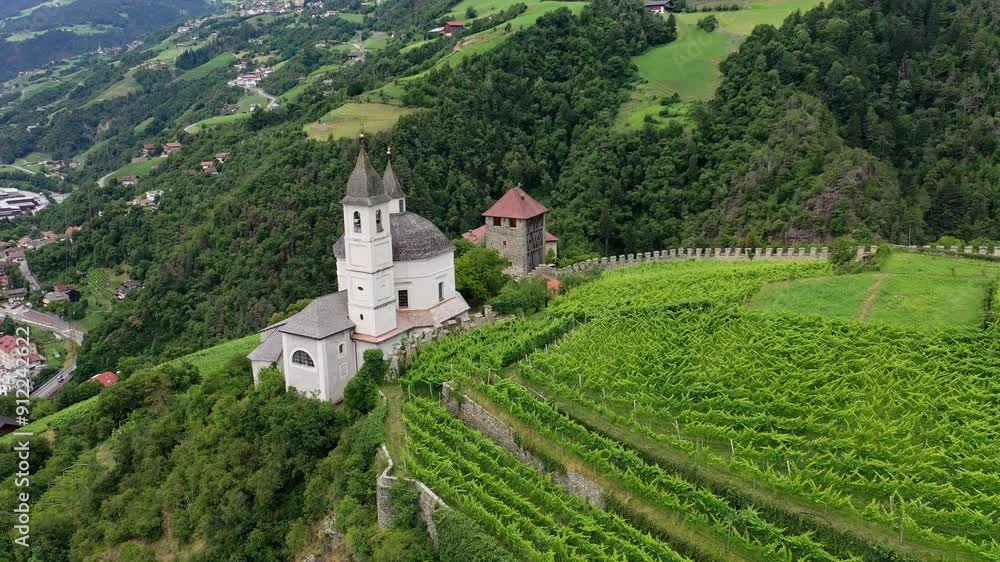 Aerial view of Castle on the rock, vineyards and winery on a sunny summer day Bolzano Italy Aerial view of Castle on the rock, vineyards and winery on a sunny summer day Bolzano Italy