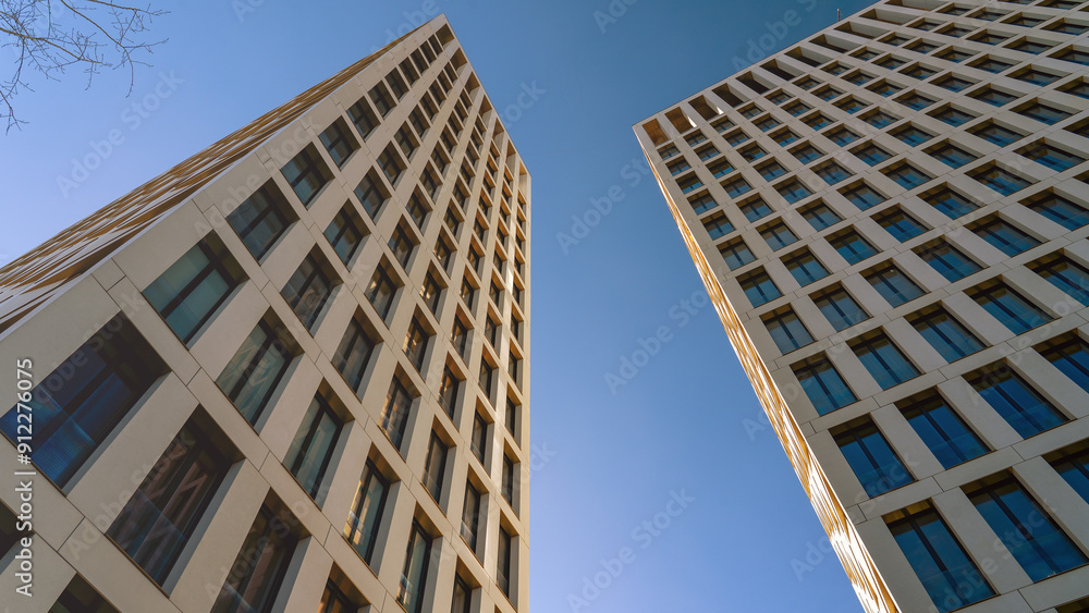 Moscow May 10 2024, Two tall buildings with many windows and a clear blue sky in the background. The buildings are very tall and have a modern look. Moscow May 10 2024, Two tall buildings with many windows and a clear blue sky in the background. The buildings are very tall and have a modern look.