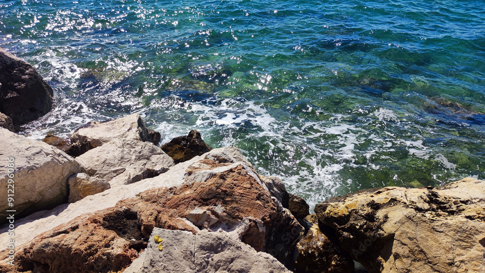 Adriatic sea surface with pebbles and stones Adriatic sea surface with pebbles and stones