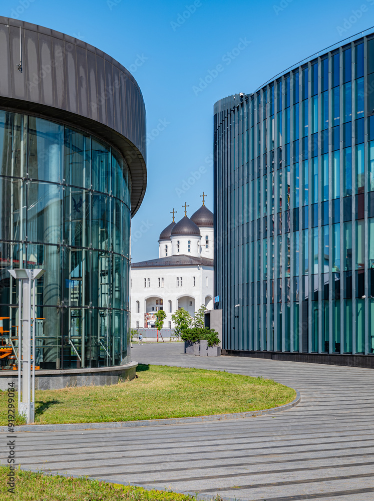 view of the church between the glass buildings view of the church between the glass buildings