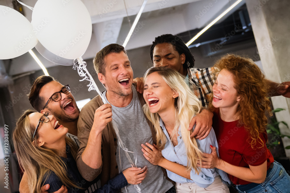 Happy business people celebrating success at company Happy business people celebrating success at company