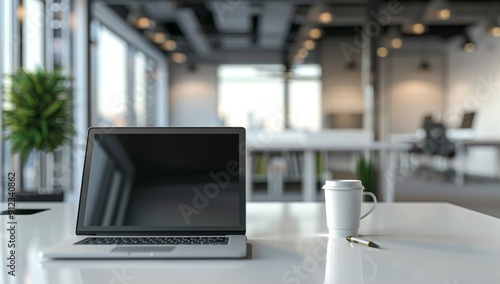 Laptop, Coffee Cup, and Pen on a White Desk in an Office