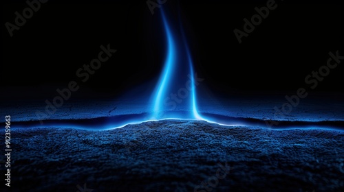 Blue flame flickering from a rift in the dark, cold ground