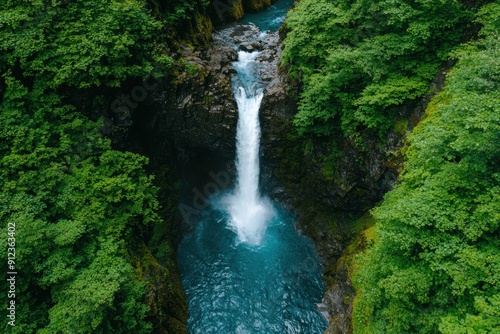 Majestic waterfall surrounded by lush green forest