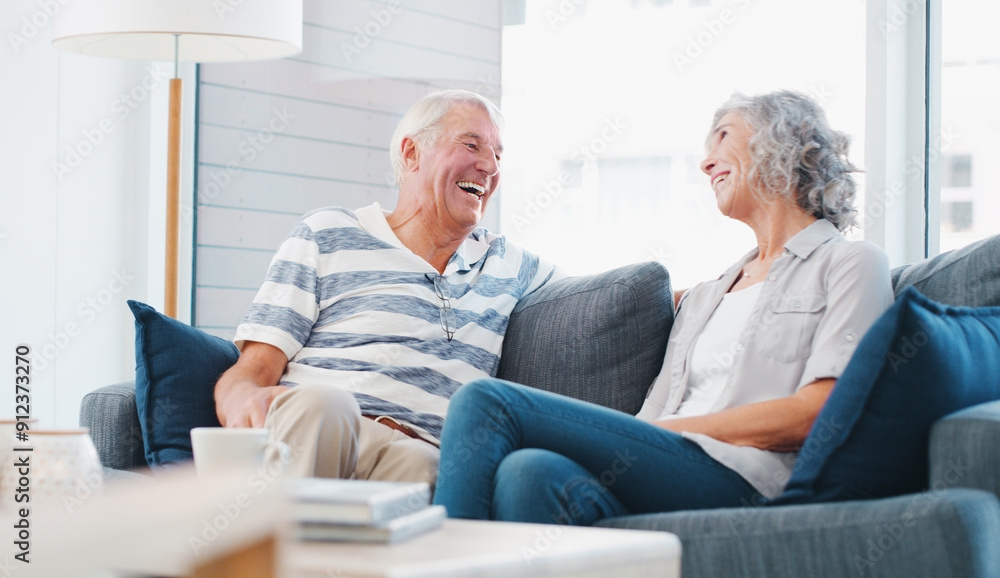 Senior couple, home and laughing on sofa in living room on break, bonding and relax. People, relationship and happy for love with gossip for conversation, chat and funny memories for retirement Senior couple, home and laughing on sofa in living room on break, bonding and relax. People, relationship and happy for love with gossip for conversation, chat and funny memories for retirement