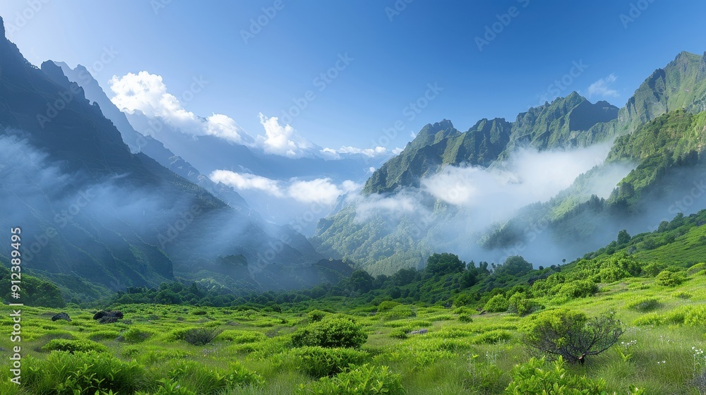 A mountain range with a foggy sky and a lush green field A mountain range with a foggy sky and a lush green field
