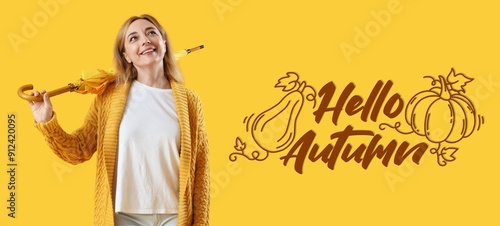 Mature woman with umbrella ...