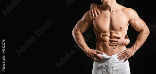 Woman touching body of musc...