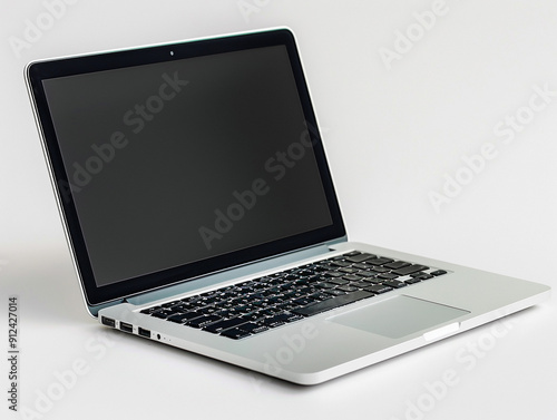 Wallpaper Mural Sleek Silver Laptop Open On Table Highlighting Modern Technology and Design in Natural Light Torontodigital.ca