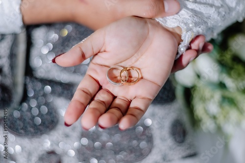 Wedding ring on the bride's palm, taken using a macro or close-up photo technique photo