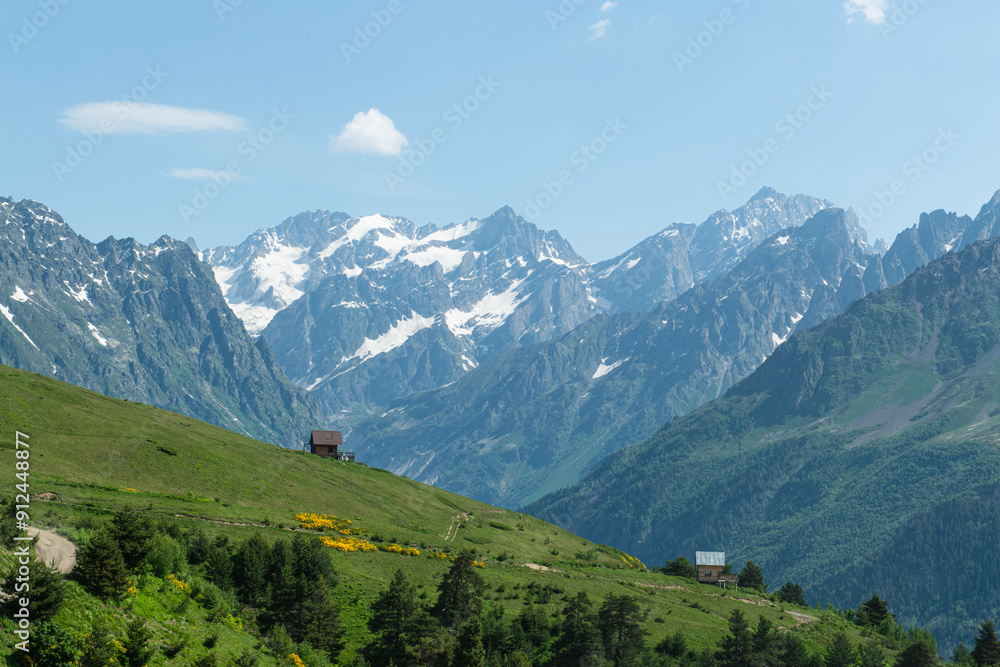 Fototapeta premium Magnificent mountains to trek in Mestia. Blooming mountain views in snowy weather in Mestia Georgia. Magnificent Mestia mountain views. Koruldi Lake trekking route.