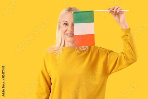Smiling blonde woman holdin...