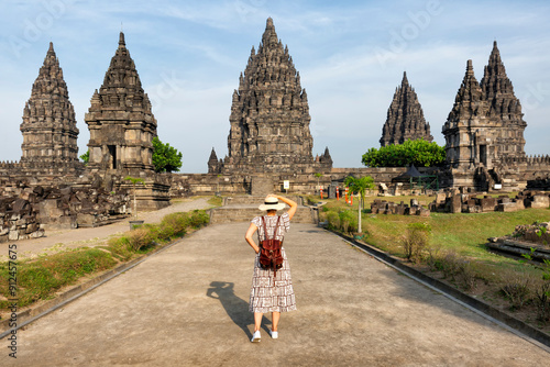 Woman traveler at Prambanan temple near Yogyakarta city, Central Java, Indonesia photo