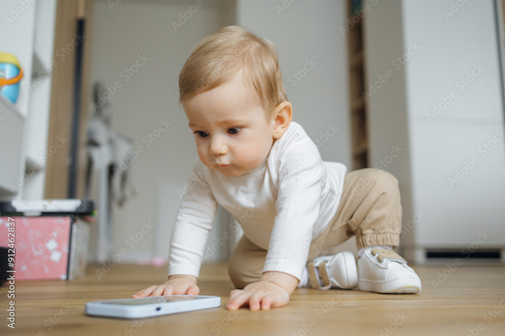 Curious Baby Playing With Smartphone at Home in Cozy Living Room Curious Baby Playing With Smartphone at Home in Cozy Living Room