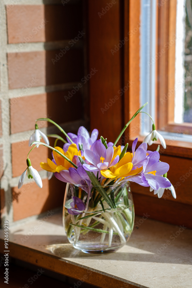 Bouquet of purple crocus in vase. Spring flowers in a vase.