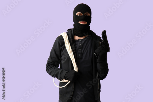 Male thief with rope and gu...