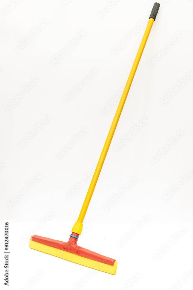 Yellow and Red Floor Squeegee with Handle Isolated on White Background Yellow and Red Floor Squeegee with Handle Isolated on White Background