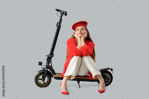 Stylish young woman with el...