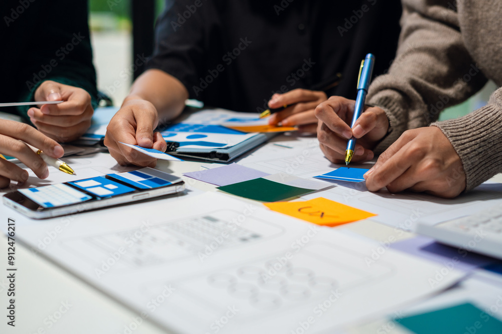 Creative digital development agency. developer team brainstorming on their project with laptop, smartphone and digital tablet. Creative digital development agency. developer team brainstorming on their project with laptop, smartphone and digital tablet.