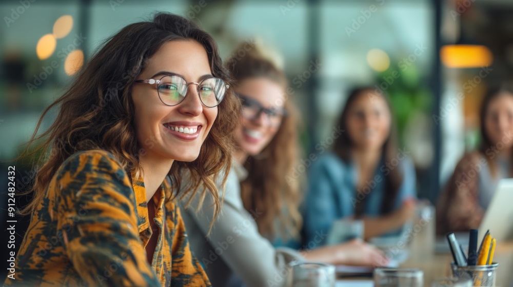 Female entrepreneurs attending an online meeting in an office Female entrepreneurs attending an online meeting in an office
