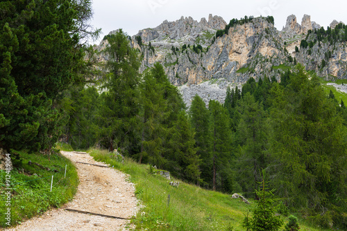 Hiking in Ciampedie near Catinaccio mountain following the path to Malga Vael - Val di Fassa - Italy photo