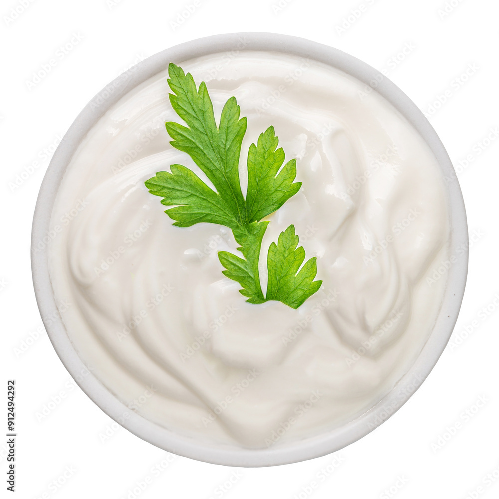Bowl of sour cream dip sauce with herbs isolated on white background. Fresh sauce or greek yogurt tzatziki with parsley top view Bowl of sour cream dip sauce with herbs isolated on white background. Fresh sauce or greek yogurt tzatziki with parsley top view