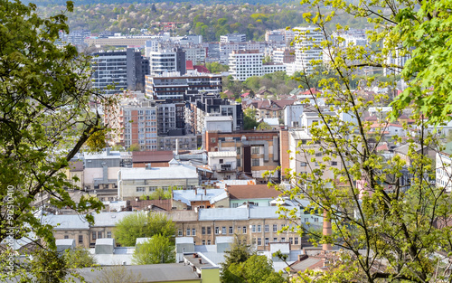 view of the ancient city of Lviv from the Castle Hill through the trees