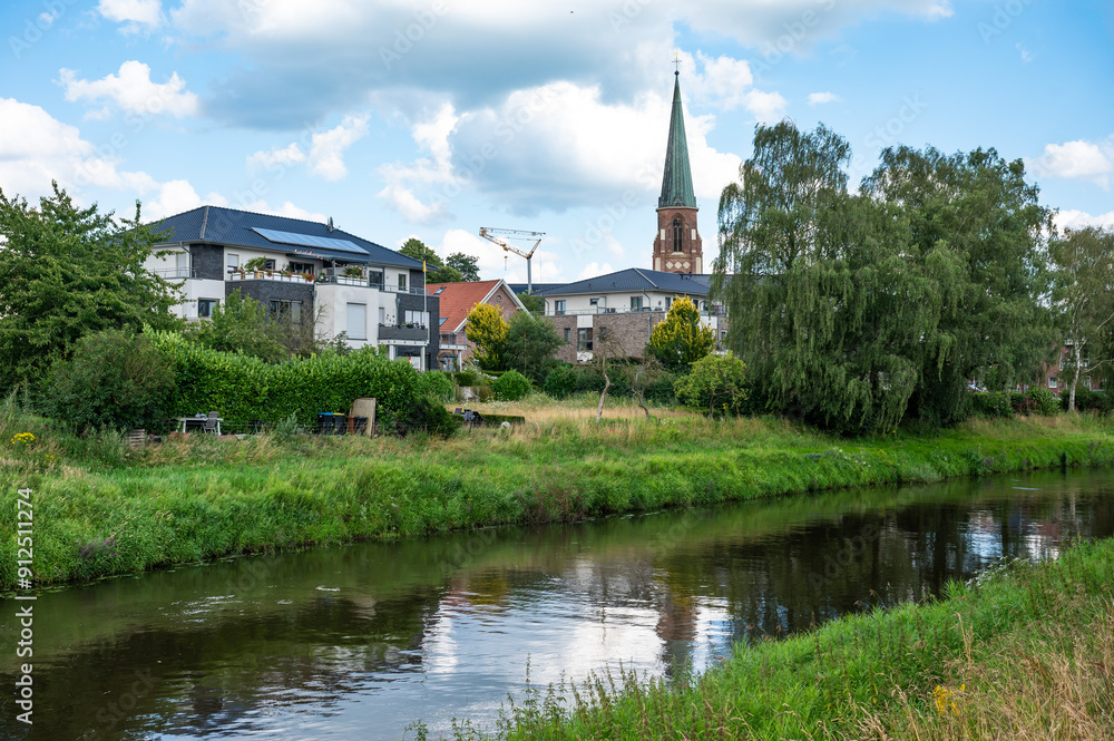 Herzlake, Lower Saxony, Germany, July 14, 2024 - Village reflections in the water of the River Hase Herzlake, Lower Saxony, Germany, July 14, 2024 - Village reflections in the water of the River Hase