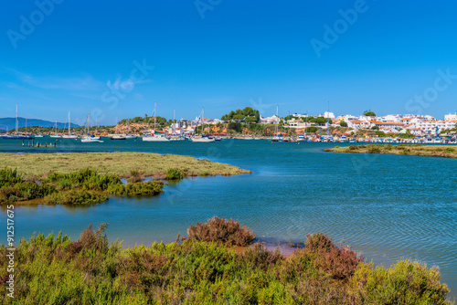 Alvor Portugal view from lagoon across and river marshes to Algarve town 