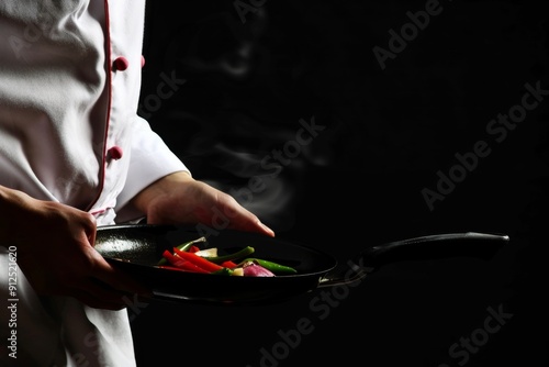 A Culinary Masterpiece Unfolding in a Dimly Lit Kitchen With Fresh Vegetables Sizzling in a Pan photo