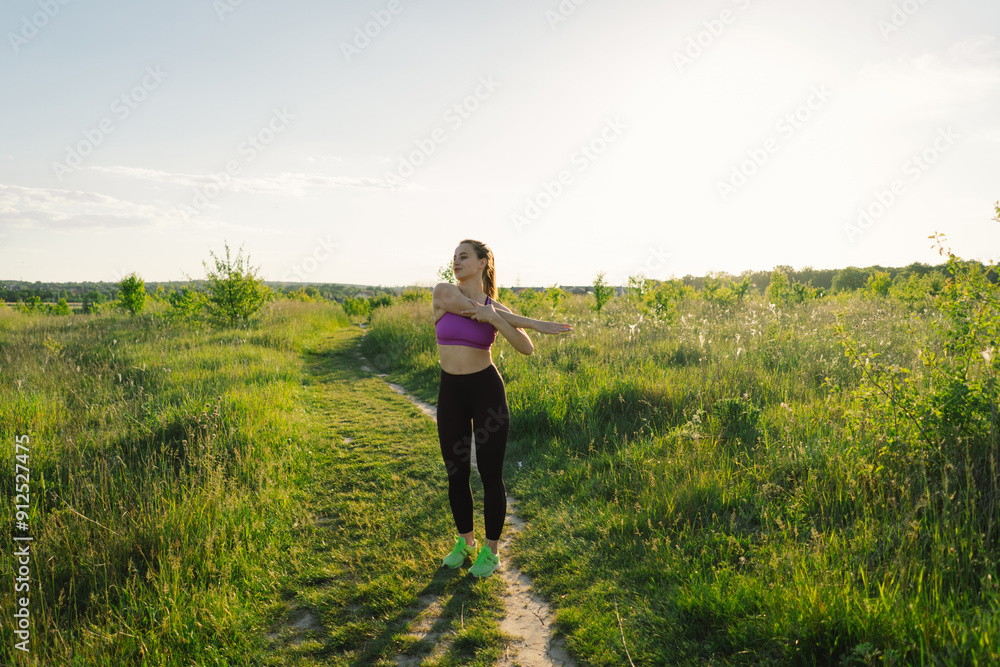 Beautiful girl doing fitness or yoga in nature on a sunny summer sunset. Beautiful girl doing fitness or yoga in nature on a sunny summer sunset.