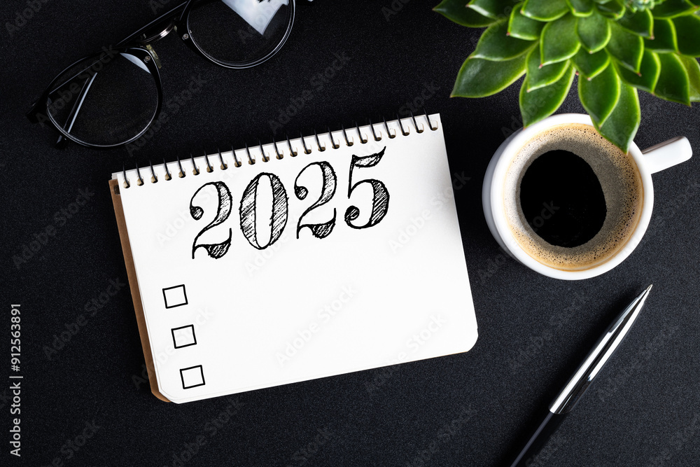 2025 New year resolutions on desk. 2025 goals list with notebook ...