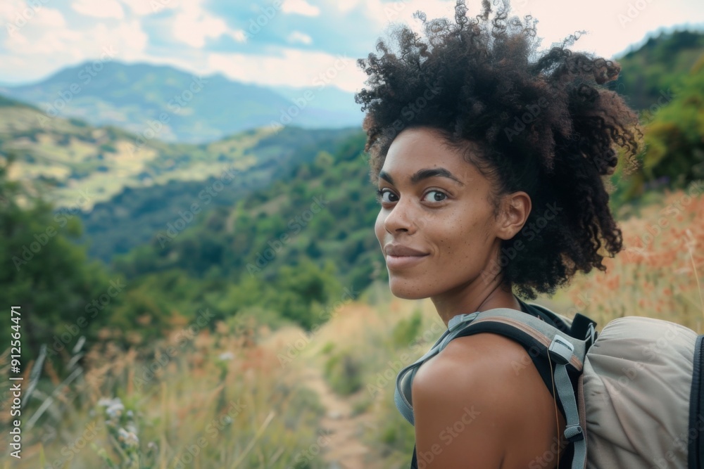 Portrait of a young black woman hiking in beautiful scenery during summer Portrait of a young black woman hiking in beautiful scenery during summer