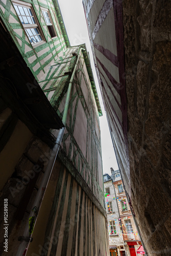 Rouen, Normandy, Place du Lieutenant Aubert seen from one of the narrowest street in France, between traditional colorful half-timbered corbelled houses photo