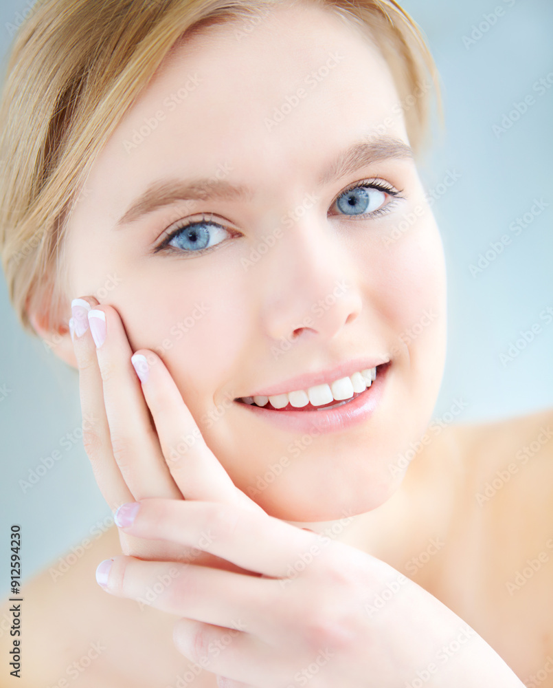 Portrait, relax and happy woman in studio for beauty or treatment for facial glow, shine or wellness. Dermatology, hands or girl with face routine for cosmetics or natural skincare by blue background Portrait, relax and happy woman in studio for beauty or treatment for facial glow, shine or wellness. Dermatology, hands or girl with face routine for cosmetics or natural skincare by blue background