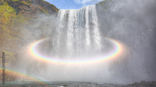 Fotografia Skogafoss, meaning Forest Falls, is one of Iceland's most stunning waterfalls