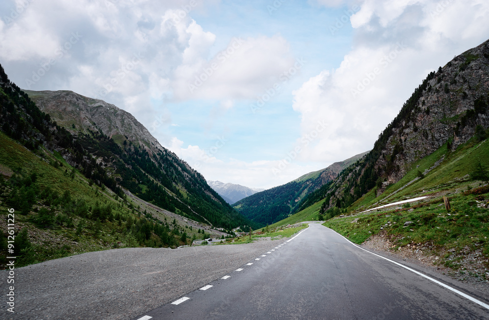 Fototapeta premium Asphalt road in Alps mountains. Road trip concept. Beautiful landscape.