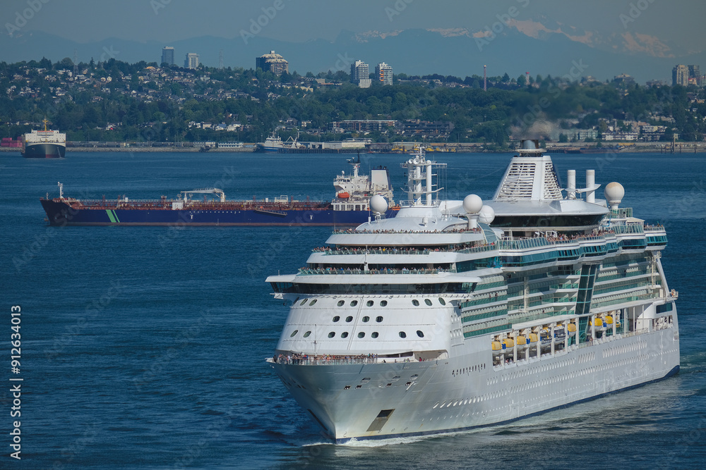 Modern cruiseship cruise ship ocean liner Brilliance sail away departure from port of Vancouver, British Columbia for Alaska summer cruising on sunny day with city skyline Lions Gate Bridge Modern cruiseship cruise ship ocean liner Brilliance sail away departure from port of Vancouver, British Columbia for Alaska summer cruising on sunny day with city skyline Lions Gate Bridge