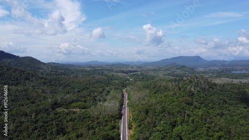 Natural scenery of the mountains and the waters of Riam Kanan in Banjarbaru, South Kalimantan with a background of sky and clouds photo