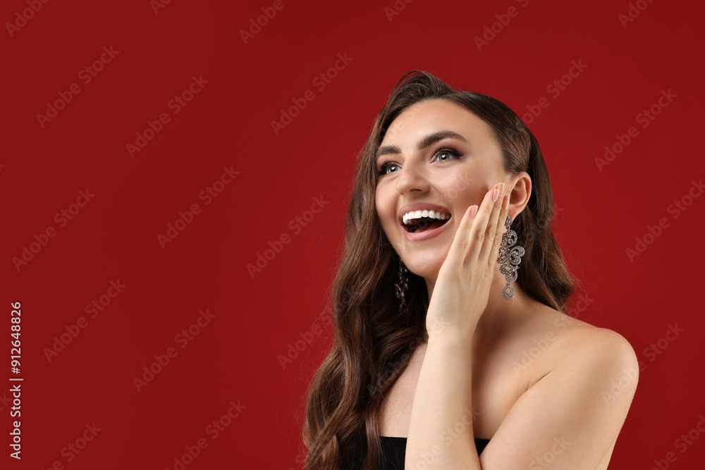 Portrait of happy woman on red background. Space for text Portrait of happy woman on red background. Space for text