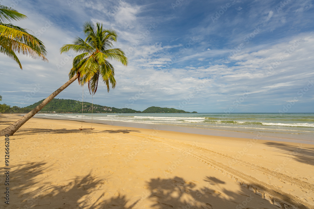 Summer background of Coconut Palm trees on white sandy beach Landscape nature view Romantic ocean bay with blue water and clear blue sky over sea at Phuket island Thailand. Summer background of Coconut Palm trees on white sandy beach Landscape nature view Romantic ocean bay with blue water and clear blue sky over sea at Phuket island Thailand.