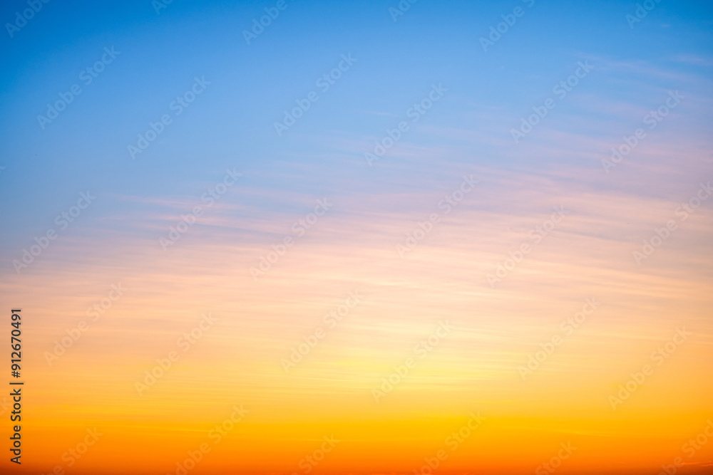Obraz premium Beautiful , luxury soft gradient orange gold clouds and sunlight on the blue sky perfect for the background, take in everning,Twilight, Large size, high definition landscape photo