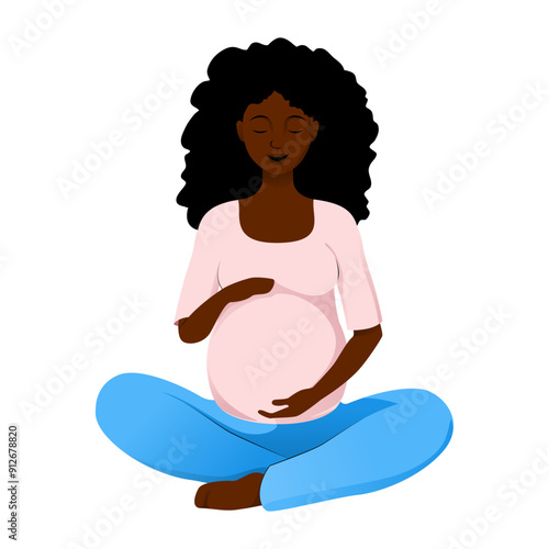 African american pregnant woman with curly hair, wearing a pink top and blue pants in lotus pose and holding her belly