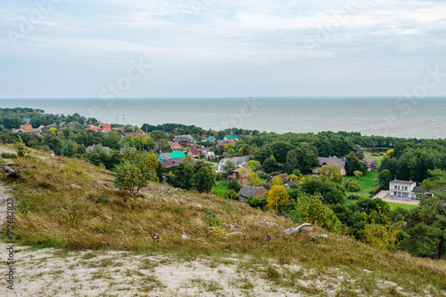 View from hill to village of Morskoe and bay. Curonian Spit. Kaliningrad region. Russia photo