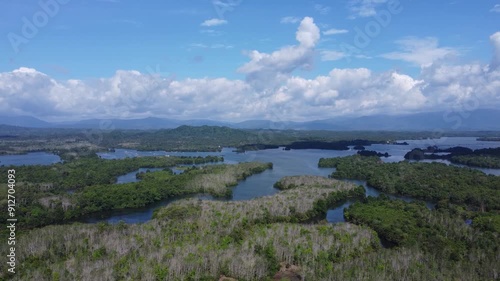 Natural scenery of the mountains and the waters of Riam Kanan in Banjarbaru, South Kalimantan with a background of sky and clouds photo