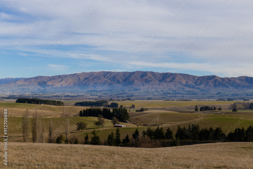 Fototapeta premium Meadow field view with the mountain in the background.