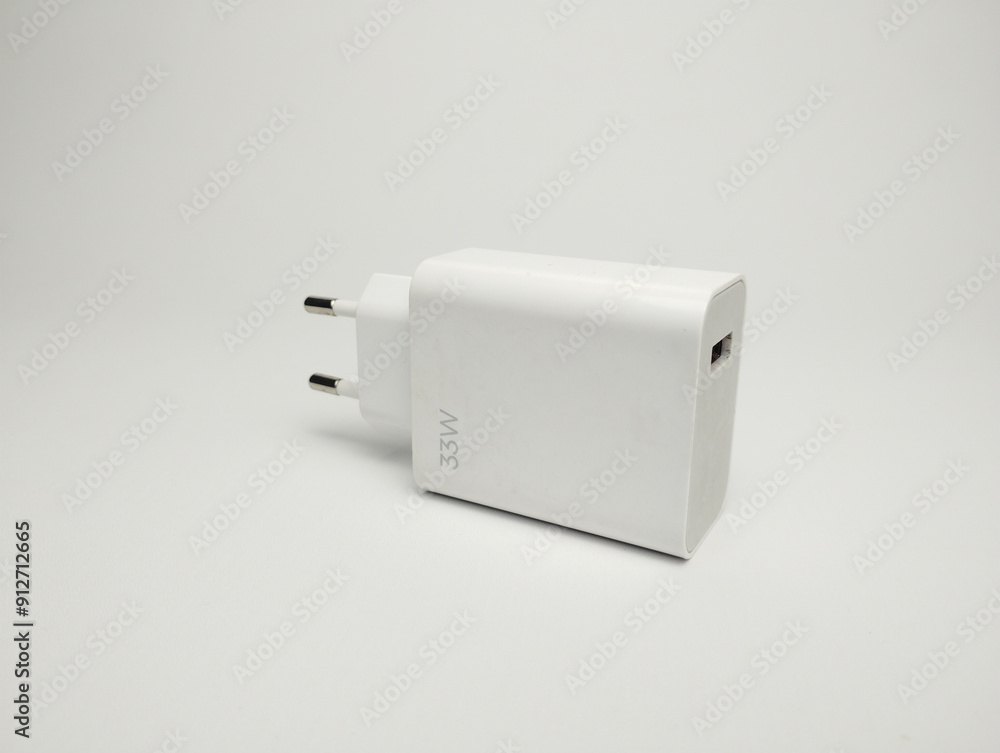 White phone charger head isolated on white background. USB charger White phone charger head isolated on white background. USB charger