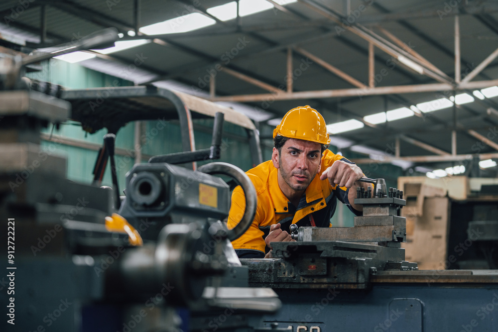 Caucasian engineer using a laptop in a factory. man working in plastics factory. Caucasian engineer using a laptop in a factory. man working in plastics factory.
